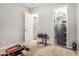 Home gym setup with adjustable bench and weights for a complete workout experience at 19571 E Strawberry Dr, Queen Creek, AZ 85142