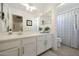 Bright bathroom features a large mirror and a white vanity at 20563 W White Rock Rd, Buckeye, AZ 85396