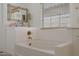 Bright bathroom featuring a bathtub and stylish textures at 20563 W White Rock Rd, Buckeye, AZ 85396