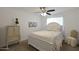Bright bedroom features a ceiling fan and a bed with floral bedding at 20563 W White Rock Rd, Buckeye, AZ 85396