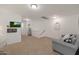 Bright bonus room features neutral walls and carpet flooring at 20563 W White Rock Rd, Buckeye, AZ 85396