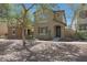 Charming two-story home featuring desert landscaping and a welcoming front porch at 20563 W White Rock Rd, Buckeye, AZ 85396