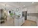 Bright kitchen with granite countertops, a center island with pendant lighting, and stainless steel appliances at 20563 W White Rock Rd, Buckeye, AZ 85396