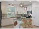 Modern kitchen featuring white cabinets, stainless steel appliances, and a granite island at 20563 W White Rock Rd, Buckeye, AZ 85396