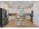 Modern kitchen featuring white cabinets, stainless steel appliances, and a granite island at 20563 W White Rock Rd, Buckeye, AZ 85396