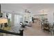Open living space with tile flooring, leading to the dining area and kitchen at 20563 W White Rock Rd, Buckeye, AZ 85396