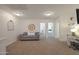 Inviting living room with neutral colors, a comfortable couch, and light-filled interior exudes warmth at 20563 W White Rock Rd, Buckeye, AZ 85396