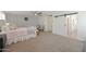 Spacious primary bedroom with carpet, furnishings and a barn door at 20563 W White Rock Rd, Buckeye, AZ 85396