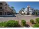 Attractive street view showcasing shopping and dining, surrounded by lush landscaping and palm trees, inviting exploration at 20563 W White Rock Rd, Buckeye, AZ 85396