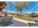 Relaxing back patio with outdoor seating, views of lush greenery, perfect for enjoying the outdoors at 2277 N Recker Rd # 6, Mesa, AZ 85215