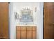 Bathroom featuring natural wood cabinets, a large mirror, modern lighting, and neutral walls at 2277 N Recker Rd # 6, Mesa, AZ 85215