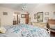 Spacious bedroom with carpet flooring, ceiling fan, and a bright ensuite bathroom at 2277 N Recker Rd # 6, Mesa, AZ 85215