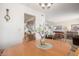 Cozy dining area with round table, seating, and views into the living room and stainless steel appliances at 2277 N Recker Rd # 6, Mesa, AZ 85215