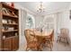 Bright dining room with chandelier, a wooden table, and decorative accents at 2277 N Recker Rd # 6, Mesa, AZ 85215