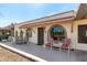 Charming home exterior with a covered patio, seating area, and well-maintained landscaping, creating curb appeal at 2277 N Recker Rd # 6, Mesa, AZ 85215