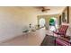 Relaxing covered patio with ceiling fan, furniture, and access to the community at 2277 N Recker Rd # 6, Mesa, AZ 85215