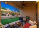 Inviting covered patio, string lights, and playset with well-manicured landscaping at 23005 N 19Th Way, Phoenix, AZ 85024
