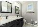 Bathroom featuring double sinks, modern fixtures, and an attractive vanity with countertop at 23005 N 19Th Way, Phoenix, AZ 85024