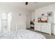A bedroom with a TV on top of a dresser and a doorway leading to the bathroom is a private retreat at 23005 N 19Th Way, Phoenix, AZ 85024