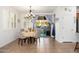 Sunlit dining area with shuttered window, tile floors, chandelier, and slider to the backyard at 23005 N 19Th Way, Phoenix, AZ 85024
