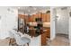Kitchen island offers barstool seating, granite countertops, and seamless flow into the living area at 23005 N 19Th Way, Phoenix, AZ 85024