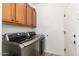 Well-equipped laundry room with modern washer and dryer units and upper cabinet storage at 23005 N 19Th Way, Phoenix, AZ 85024