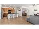 Open-concept home showcases tile floors, barstool seating, kitchen island, and cozy living area at 23005 N 19Th Way, Phoenix, AZ 85024