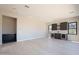 Open living area featuring a stylish wet bar with marble counters and wine storage at 23656 N 123Rd St # 240, Scottsdale, AZ 85255