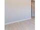 Bedroom featuring light wood floors, white walls, and white baseboards at 23656 N 123Rd St # 240, Scottsdale, AZ 85255