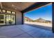 View from the covered patio overlooking the desert landscape and mountains beyond at 23656 N 123Rd St # 240, Scottsdale, AZ 85255