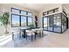 A bright dining room offers views through expansive sliding doors that open to the yard at 23656 N 123Rd St # 240, Scottsdale, AZ 85255