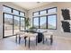 A bright dining room features mountain views through floor-to-ceiling windows and sliding doors at 23656 N 123Rd St # 240, Scottsdale, AZ 85255