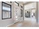 Bright entryway with a modern front door, sleek windows and hallway to a bar at 23656 N 123Rd St # 240, Scottsdale, AZ 85255