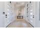 Elegant entryway featuring double doors, light wood floors, and stylish decor at 23656 N 123Rd St # 240, Scottsdale, AZ 85255