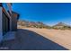 Rear exterior view of the home, showing the gravel landscaping at 23656 N 123Rd St # 240, Scottsdale, AZ 85255