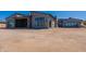 Wide exterior shot highlighting the back of this desert home and three car garage at 23656 N 123Rd St # 240, Scottsdale, AZ 85255