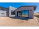 Modern house showcasing a stucco exterior, large windows, and a scenic desert view at 23656 N 123Rd St # 240, Scottsdale, AZ 85255