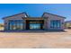 Wide exterior shot highlighting the back of this desert home and sliding glass doors at 23656 N 123Rd St # 240, Scottsdale, AZ 85255