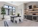 Modern home office with natural light, a desk, and a built-in bar area at 23656 N 123Rd St # 240, Scottsdale, AZ 85255