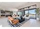 Bright living room with expansive sliding glass doors, comfortable seating, and seamless flow to a modern kitchen at 23656 N 123Rd St # 240, Scottsdale, AZ 85255