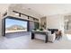Bright living room showcases sliding glass doors, a modern fireplace, and comfortable seating arrangement with outdoor vista at 23656 N 123Rd St # 240, Scottsdale, AZ 85255