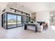Bright living room offers sliding glass doors with mountain views, a modern fireplace, and comfortable seating at 23656 N 123Rd St # 240, Scottsdale, AZ 85255
