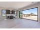 Bright living room with wet bar and large sliding doors, providing access to the outdoors at 23656 N 123Rd St # 240, Scottsdale, AZ 85255