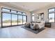 Spacious bedroom with seating area and large windows with sliding doors to the beautiful outdoor scenery at 23656 N 123Rd St # 240, Scottsdale, AZ 85255