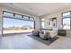 Spacious bedroom with seating area and large windows with sliding doors to the beautiful outdoor scenery at 23656 N 123Rd St # 240, Scottsdale, AZ 85255
