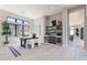 Bright office space featuring a built in bar area, desk, and large windows with a view at 23656 N 123Rd St # 240, Scottsdale, AZ 85255