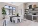 Bright office with a built in bar area, open shelving, and a sleek desk and chairs at 23656 N 123Rd St # 240, Scottsdale, AZ 85255