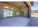 Covered outdoor patio with mountain views through expansive glass windows and doors at 23656 N 123Rd St # 240, Scottsdale, AZ 85255