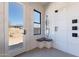 Bright shower featuring modern fixtures, a built-in bench, and exterior view of the desert landscape at 23656 N 123Rd St # 240, Scottsdale, AZ 85255