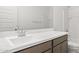 Modern bathroom features a sleek vanity with a white countertop, sink, and chrome fixtures at 23972 W Cocopah St, Buckeye, AZ 85326